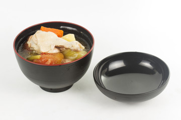 Chicken wings soup in wooden cup