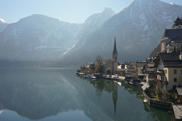Fototapeta premium Image of famous alpine village Hallstatt during colourful autumn sunrise