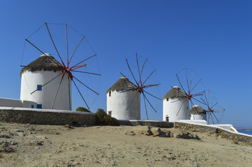 Fototapeta na wymiar Landscape with windmills and blue sky in the Greek island of Myconos