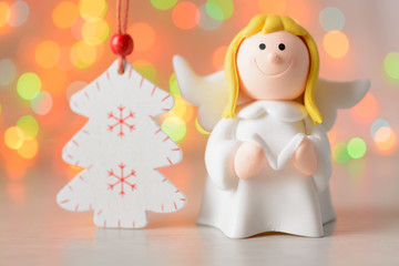 Toy angel with book in hand