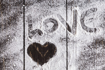 Heart shaped symbol with  powdered sugar