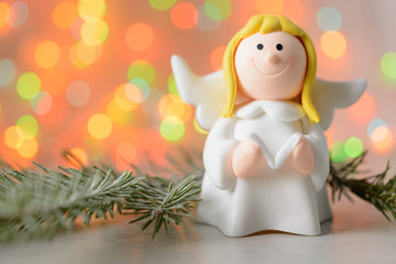 Toy angel with book in hand