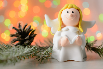 Toy angel with book in hand