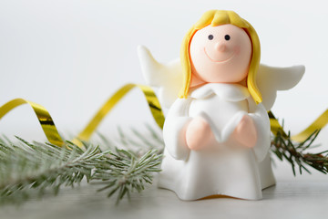 Toy angel with book in hand