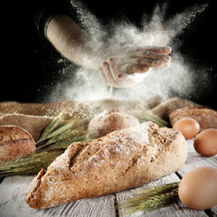 hands and flour with bread 