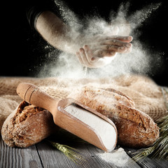 hands and flour with bread 