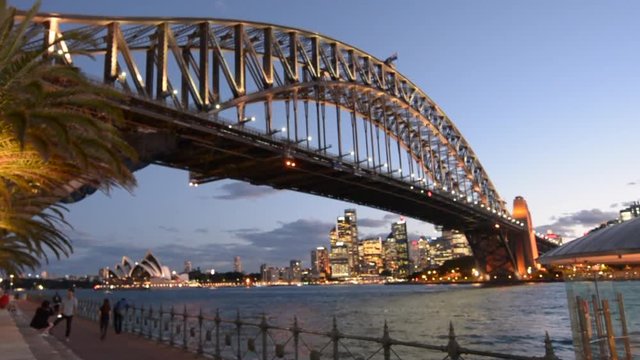 Sydney Harbour Bridge west side and Sydney Skyline at dusk light in Sydney New South Wales, Australia.