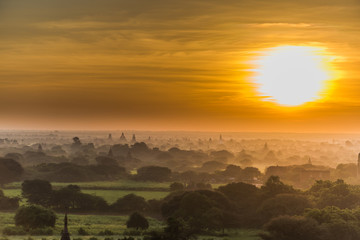 Sunrise with the view of Bagan plains and its pagodas in silhouette, Myanmar