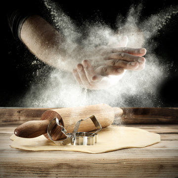 men hands and flour splash 
