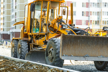 Grader working outside on road construction