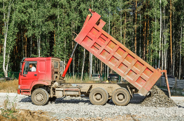Tipper working outside on road construction