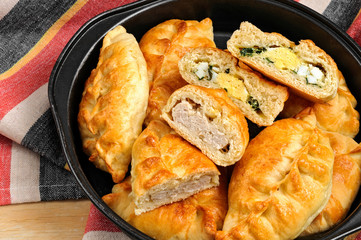 Russian pirozhki baked patties with meat and eggs