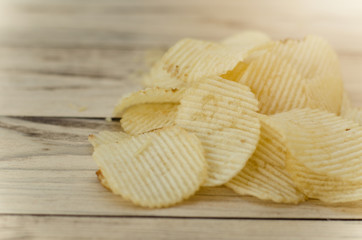 Tomato chips on wooden table, vintage image