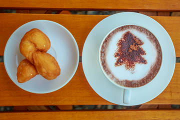 Christmas trees in coffee white cup
