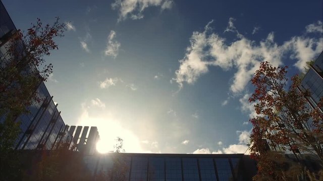 Modern building with moving fast clouds 