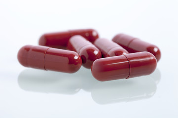 Set of capsules on white background