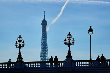 Fototapeta premium Scenic cityscape of Paris with silhouettes of people and Eiffel tower