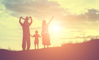 Fototapeta premium Happy family dancing on the road in the sunset time. Evening par