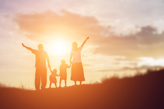 Happy Family Dancing On The Road In The Sunset Time. Evening Par