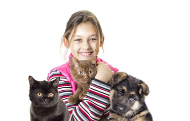 child hugging a kitten and puppy