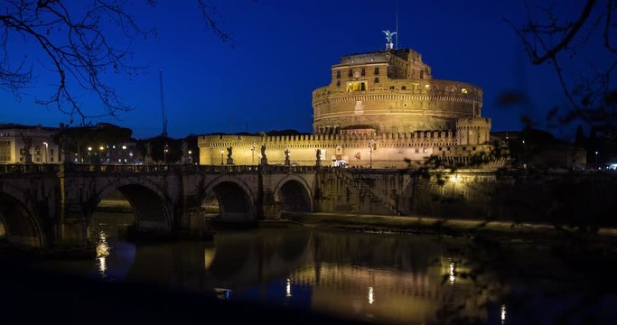 Rome, Italy - illuminated Saint Angelo's Castle with Tiber river and Bridge at night - Timelapse with motion