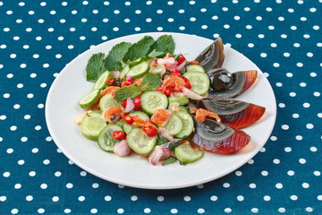 Spicy cucumber salad with dried shrimp and  preserved egg is popular Thai food.