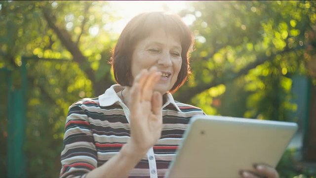 Aged Woman Talking by Skype