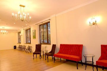 Hall interior with upholstered furniture along a wall