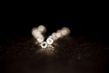 Nuts in a row with black background