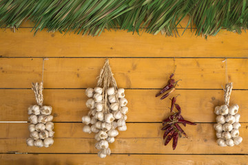 Garlic and pepper on a wooden background