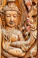 Fototapeta na wymiar The art of carved wooden in thailand temple