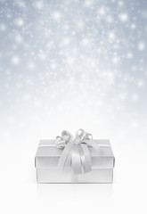 Celebration silver gift box for decoration on snow background