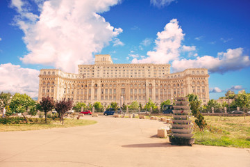 Palatul Parlamentului Bucuresti with blue sky and clouds.