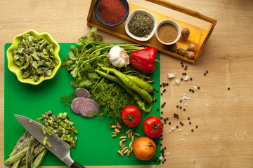 Ingredients for cooking healthy vegetarian meal full of vitamins. Sliced green beans for making lunch.