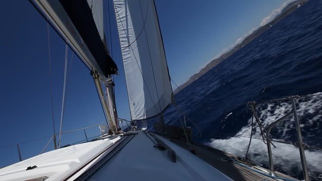 Sailing ship yachts with white sails in the Sea. Luxury boats.