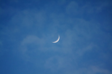 Obraz na płótnie Canvas Moon Slice in the afternoon light