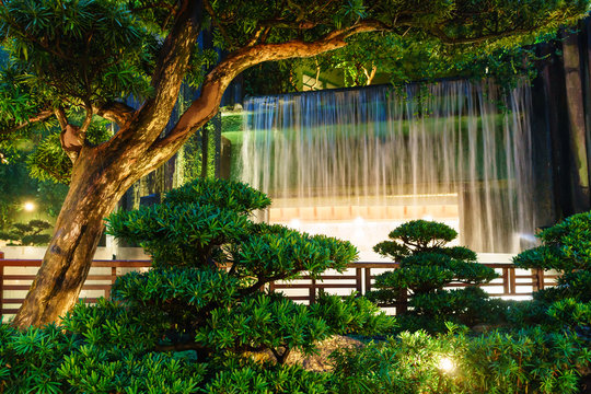 Illuminated artificial waterfall The Nan Lian Garden in Hong Kong © Wilding