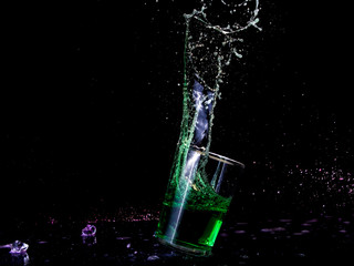 Colorful splash water in a glass