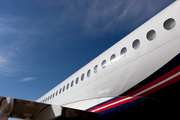 Fototapeta premium fuselage element with portholes of the aircraft Sukhoi SuperJet