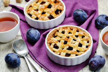 Plum cake on a wood background