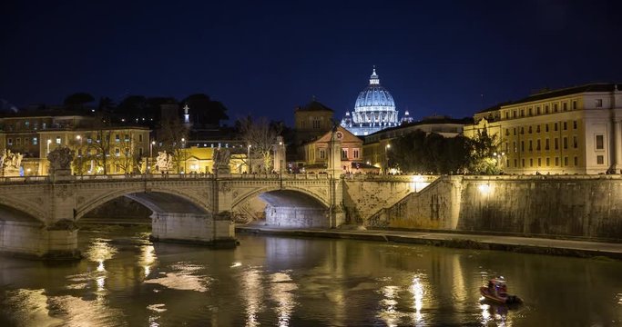 Rome, Italy - illuminated san angelo bridge with Tiber river at night with view of St Peters Basilica - Timelapse without motion - New Years Eve