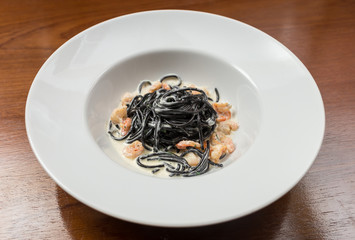 Black pasta spaghetti with seafood