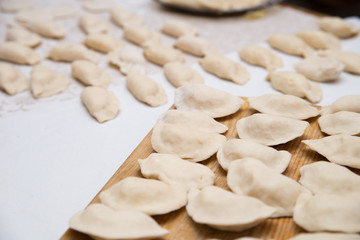 Fototapeta na wymiar Prepared dumplings on cotton cloth.