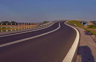 Road with traffic signs in Poland.