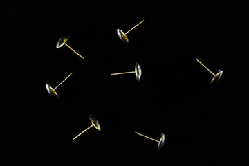 decorative bronze studs for decoration close-up, black background isolated