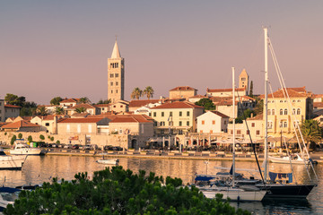 Obraz premium The town of Rab, Croatian tourist resort famous for its four bell towers.