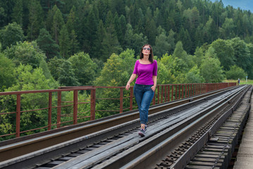 Woman and railroad. Ukraine. 
