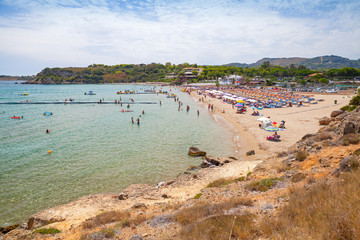 Fototapeta na wymiar Tourists relax on the beach. Zakynthos, Greece