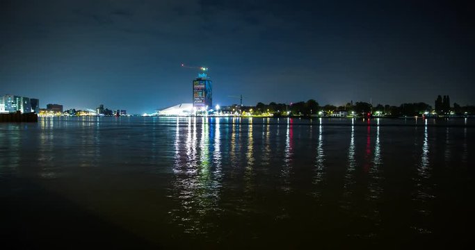 Amsterdam, Netherlands - ships in the harbor and port area of Amsterdam with Eye en IJ - Timelapse with zoom in