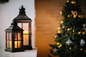 beautiful Christmas tree and new year decorations with lanterns and candles
